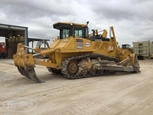 Side of used Dozer under cloudy sky